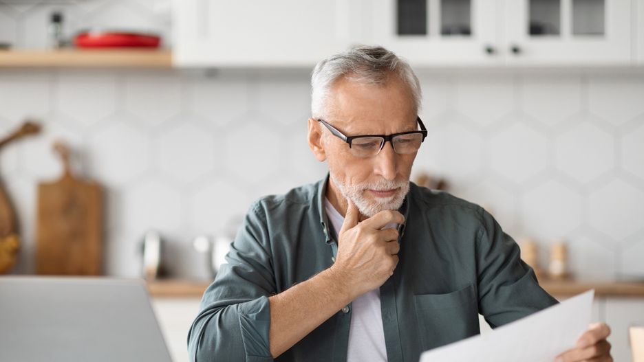 Paperwork Concept. Portrait of senior man working at home officePaperwork Concept. Portrait of senior man working at home office, holding and reading papers or financial document, sitting at desk in kitchen, using pc laptop computer for remote work, closeup shotbusiness,technology,man,house,computer,laptop,home,digital,work,communication,kitchen,glasses,person,old,interior,job,reading,online,device,eyeglasses,screen,elderly,grandfather,gadget,telecommuting,aged,distance,retired,freelance,mature,remote,pensioner,senior,gentleman,documents,papers,career,older,caucasian,white,using,internet,smiling,handsome,copy space,closeup,working,freelancer,entrepreneur,business,technology,man,house,computer,laptop,home,digital,work,communication,kitchen,glasses,person,old,interior,job,reading,online,device,eyeglasses,screen,elderly,grandfather,gadget,telecommuting,aged,distance,retired,freelance,mature,remote,pensioner,senior,gentleman,documents,papers,career,older,caucasian,white,using,internet,smiling,handsome,copy space,closeup,working,freelancer,entrepreneur