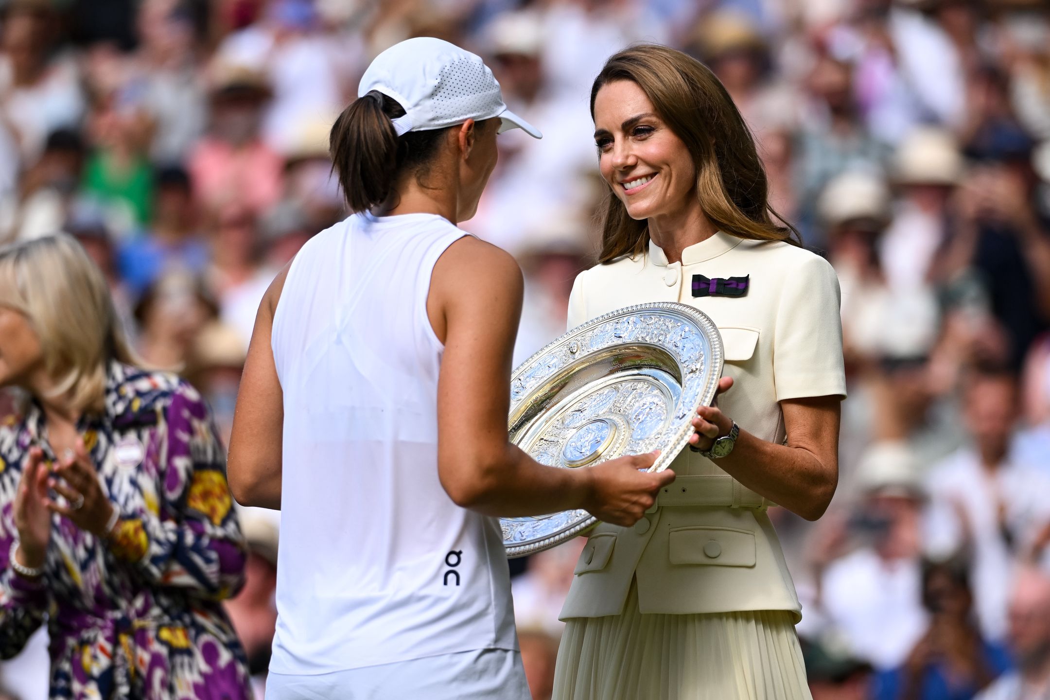 LONDON, ENGLAND - JULY 11: Catherine, Princess of Wales, Patron of The AELTC presents Iga Swiatek of Poland with the Women's Singles Trophy following the Women's Singles Final against Amanda Anisimova of United States on day twelve of The Championships Wimbledon 2025 at All England Lawn Tennis and Croquet Club on July 11, 2025 in London, England. (Photo by Daniel Kopatsch/Getty Images)