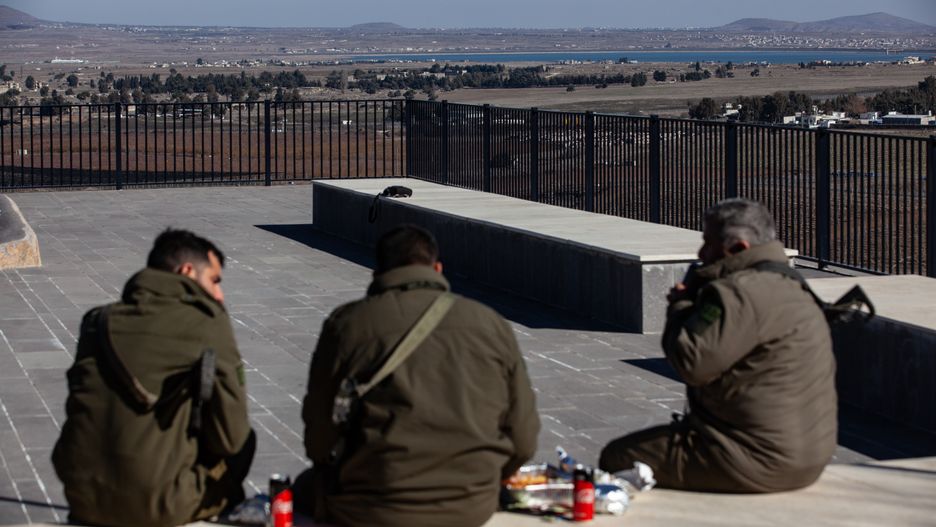 Israeli soldiers and Israeli civilians visit a lookout point next to the boundary fence delineating the UN-patrolled buffer zone between Israel and Syria in the Israeli-annexed Golan Heights, on December 15, 2024. (Photo by Mati Milstein/NurPhoto via Getty Images)