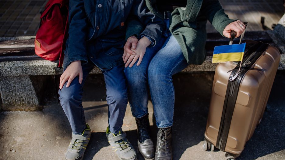 Low section of Ukrainian refugee family sitting in station when waiting to leave Ukraine due to the Russian invasion of Ukraine.
Ukrainian refugee family waiting for train in station, Ukrainian war concept.
Halfpoint Images