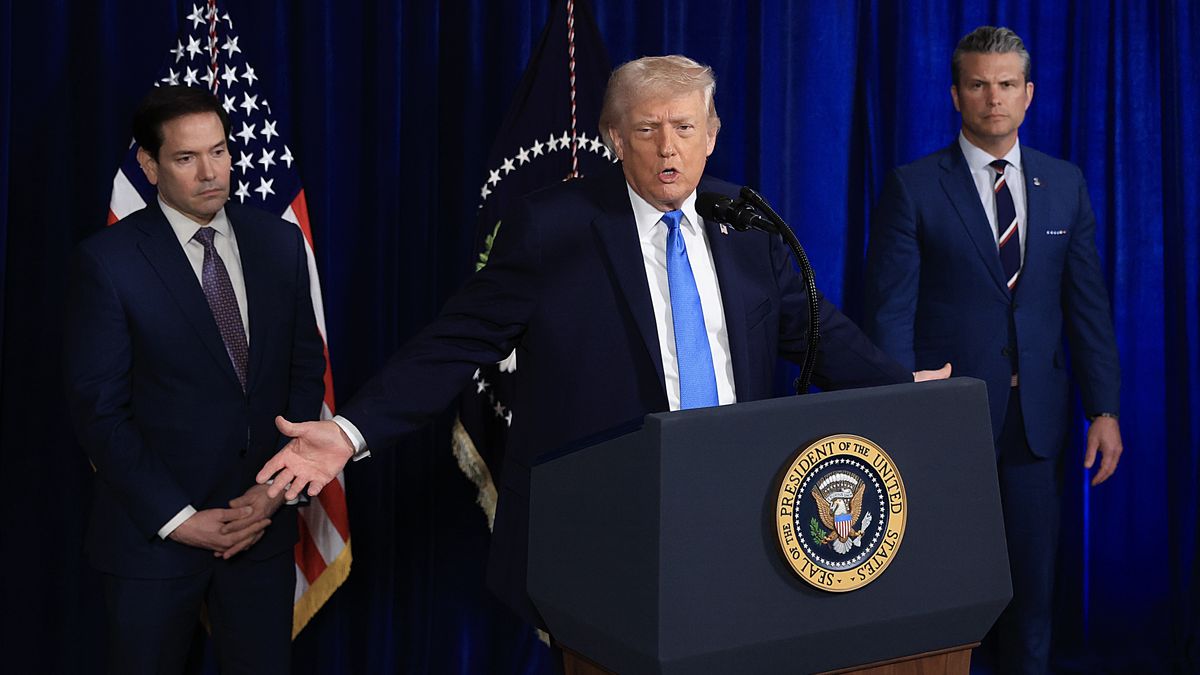 PALM BEACH, FLORIDA - JANUARY 03: Secretary of State Marco Rubio and Secretary of War Pete Hegseth listen as U.S. President Donald Trump addresses the media during a news conference at his Mar-a-Lago club on January 03, 2026, in Palm Beach, Florida. President Trump confirmed that the United States military carried out a large-scale strike in Caracas overnight, resulting in the capture of Venezuelan leader Nicolás Maduro and his wife, Cilia Flores.  (Photo by Joe Raedle/Getty Images)