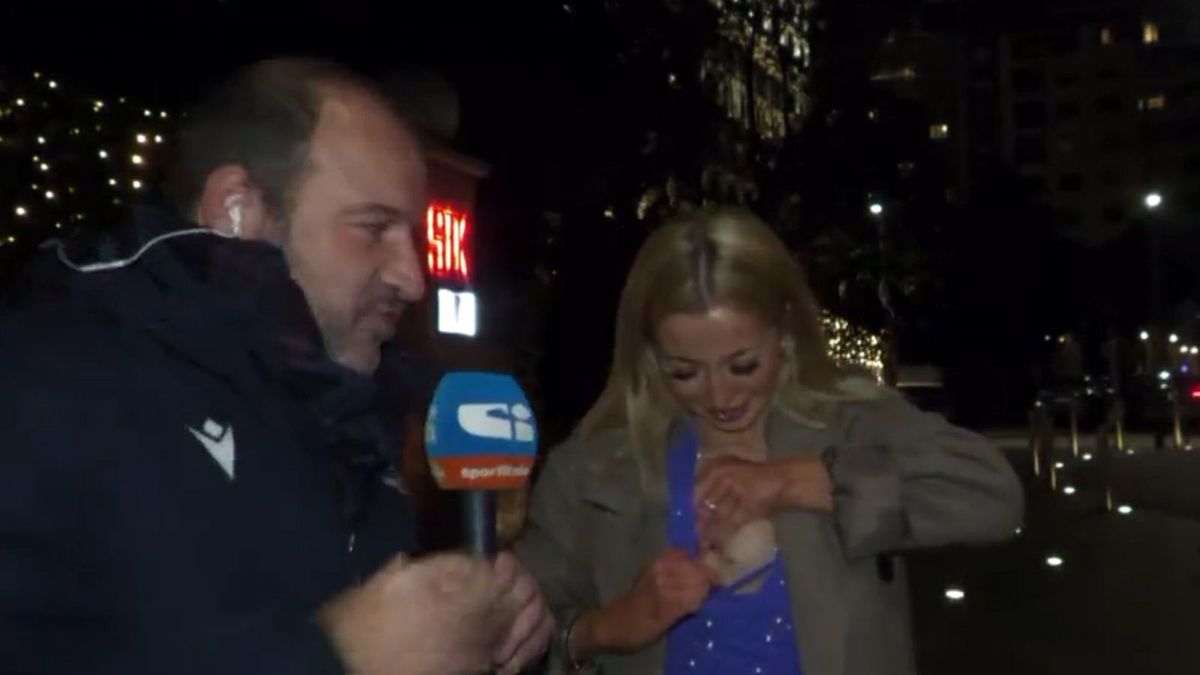 włoski dziennikarz Tancredi Palmeri i kobieta, którą zaprosił przed kamerę