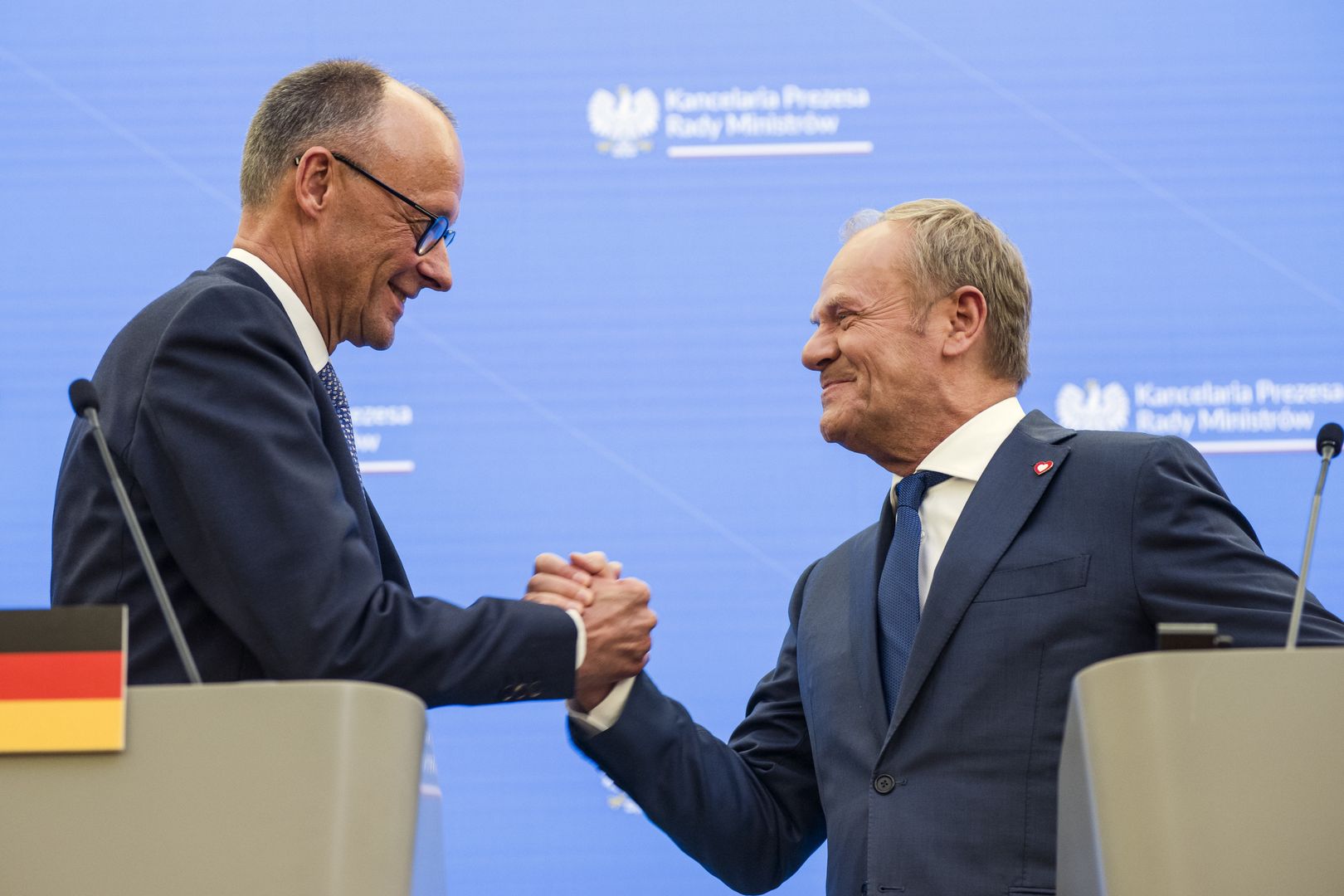 WARSAW, POLAND - 2025/05/07: Prime minister Donald Tusk (R) shake hands with the German Chancellor, Friedrich Merz (L) in the PM's Chancellery on Ujazdowskie avenue in Warsaw. The newly elected German Chancellor, Friedrich Mertz for his first visit abroad has chosen Germany's neighbour - Poland, to meet with PM Donald Tusk in Warsaw. The two politicians talked about the security of Europe and discussed the war in Ukraine, as well as economic cooperation between Poland and Germany. (Photo by Attila Husejnow/SOPA Images/LightRocket via Getty Images)