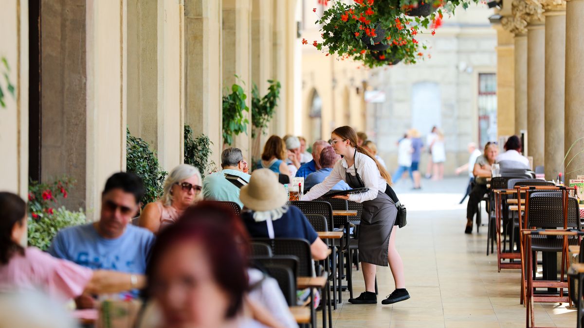 Customers are sitting in restaurant gardens on a hot day in Krakow, Poland, on June 18, 2024. (Photo by Klaudia Radecka/NurPhoto via Getty Images)