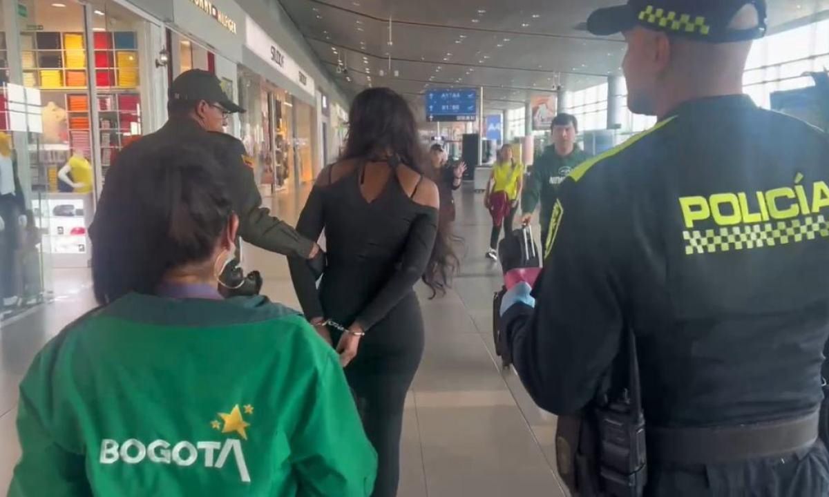 The woman was detained at the airport.
