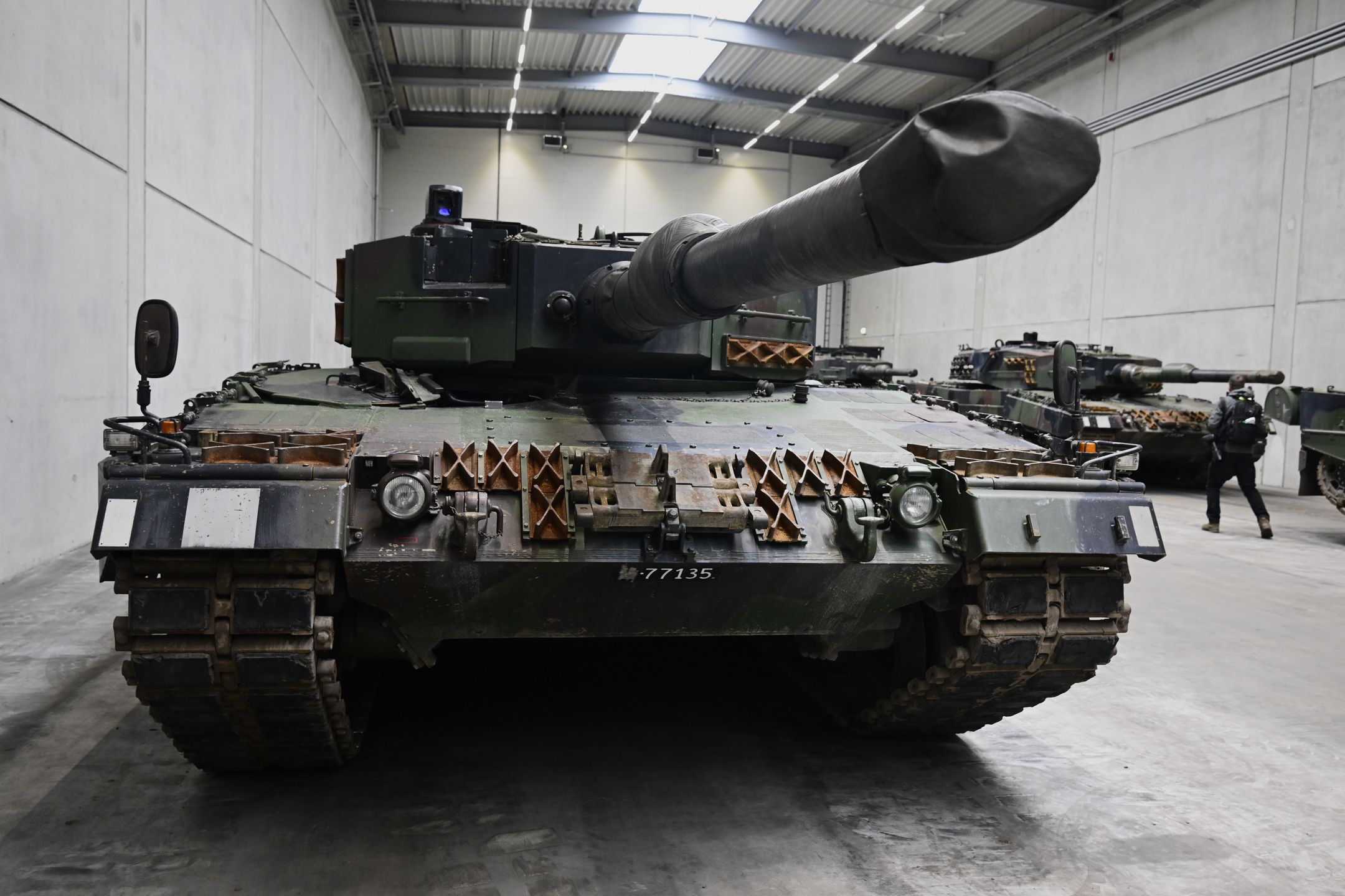 UELZEN, GERMANY - FEBRUARY 12: A view of a Leopard 2 tank at a production line as German Chancellor Olaf Scholz and Defence Minister Boris Pistorius attend the groundbreaking ceremony for a new munitions factory of German defence contractor Rheinmetall on February 12, 2024 in Unterluess, Germany. The war in Ukraine has been a boon to Rheinmetall as Germany seeks to provide Ukraine with munitions, including artillery shells, and also increase its own supply. (Photo by Fabian Bimmer - Pool/Getty Images)