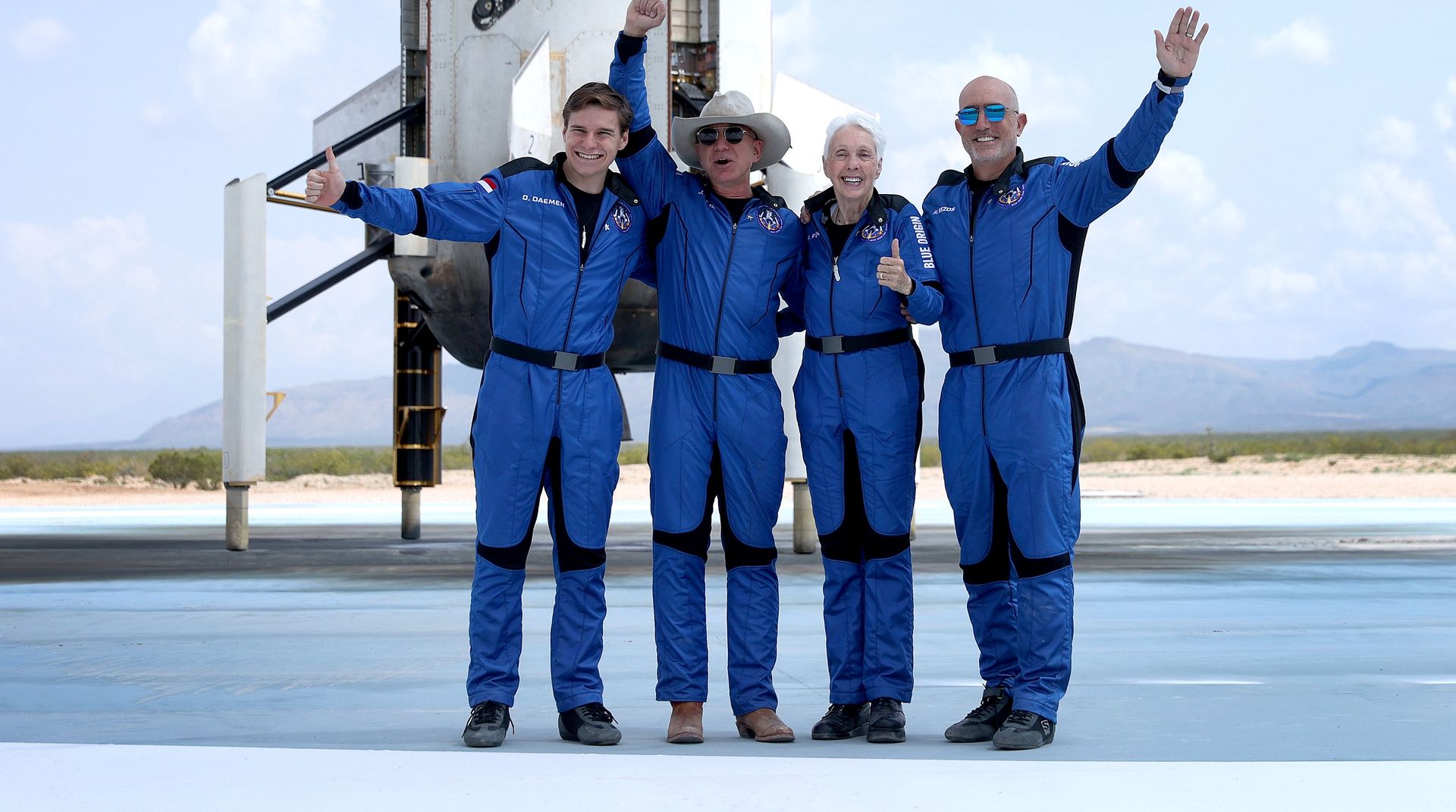 VAN HORN, TEXAS - JULY 20: Blue Origin’s New Shepard crew (L-R) Oliver Daemen, Jeff Bezos, Wally Funk, and Mark Bezos pose for a picture after flying into space in the Blue Origin New Shepard on July 20, 2021 in Van Horn, Texas. Mr. Bezos and the crew that flew with him were the first human spaceflight for the company.   (Photo by Joe Raedle/Getty Images)