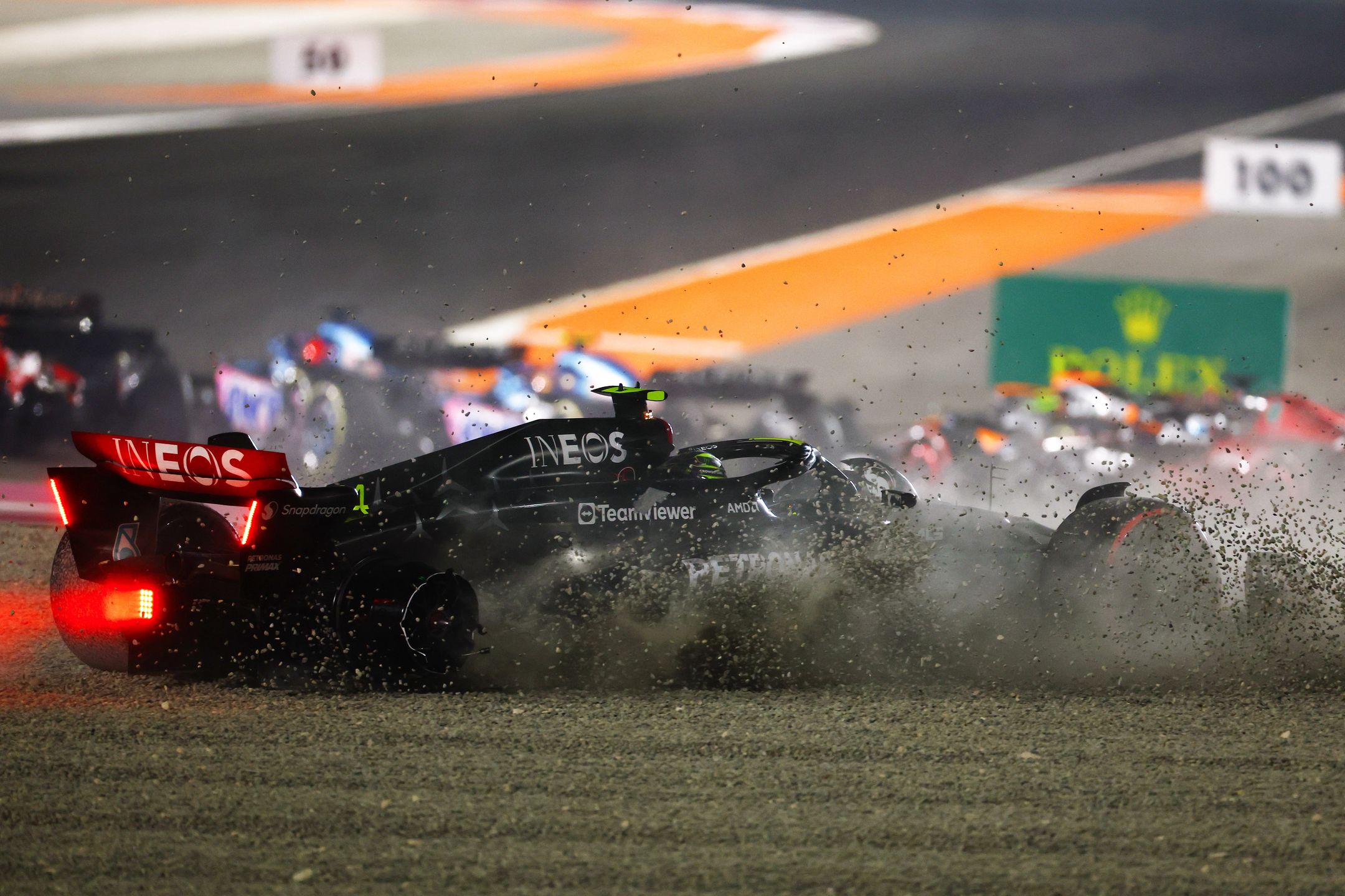 LUSAIL CITY, QATAR - OCTOBER 08: Lewis Hamilton of Great Britain driving the (44) Mercedes AMG Petronas F1 Team W14 runs into the gravel after crashing at turn one at the start during the F1 Grand Prix of Qatar at Lusail International Circuit on October 08, 2023 in Lusail City, Qatar. (Photo by Mark Thompson/Getty Images)