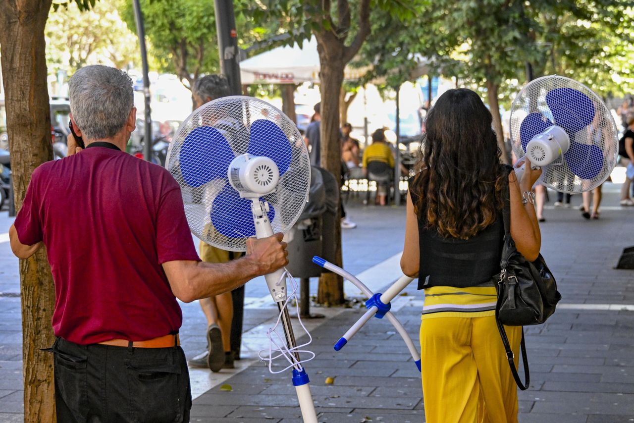 Italians cope with the heat as best as they can. Some are buying fans in great numbers.