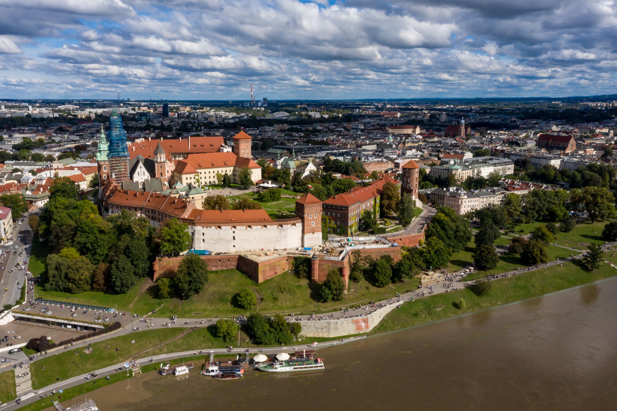 KRAKOW, MALOPOLSKIE, POLAND - 2024/09/15: (EDITORS NOTE; image taken with drone.)An aerial view of Wawel castle in the UNESCO protected Old Town of Krakow seen by the Vistula river that risen significantly after heavy rain. Heavy rains have caused water levels to rise sharply in the Vistula river leaving many towns under water. Flood emergency warning has been issued for Krakow but the situation is under control. (Photo by Dominika Zarzycka/SOPA Images/LightRocket via Getty Images)