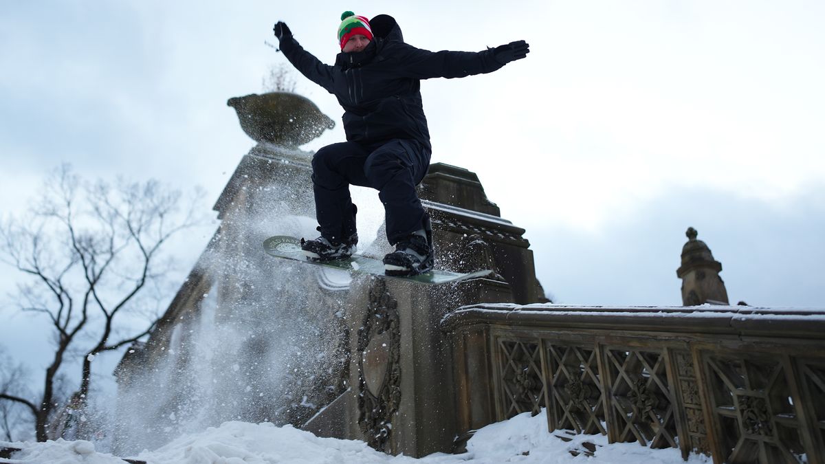 NEW YORK, NY - JANUARY 26: A young man snowboards on the snow-covered steps at Central Park on January 26, 2026 in New York City. A heavy snowfall has transformed New York City's Central Park into a winter playground. (Photo by Liao Pan/China News Service/VCG via Getty Images)