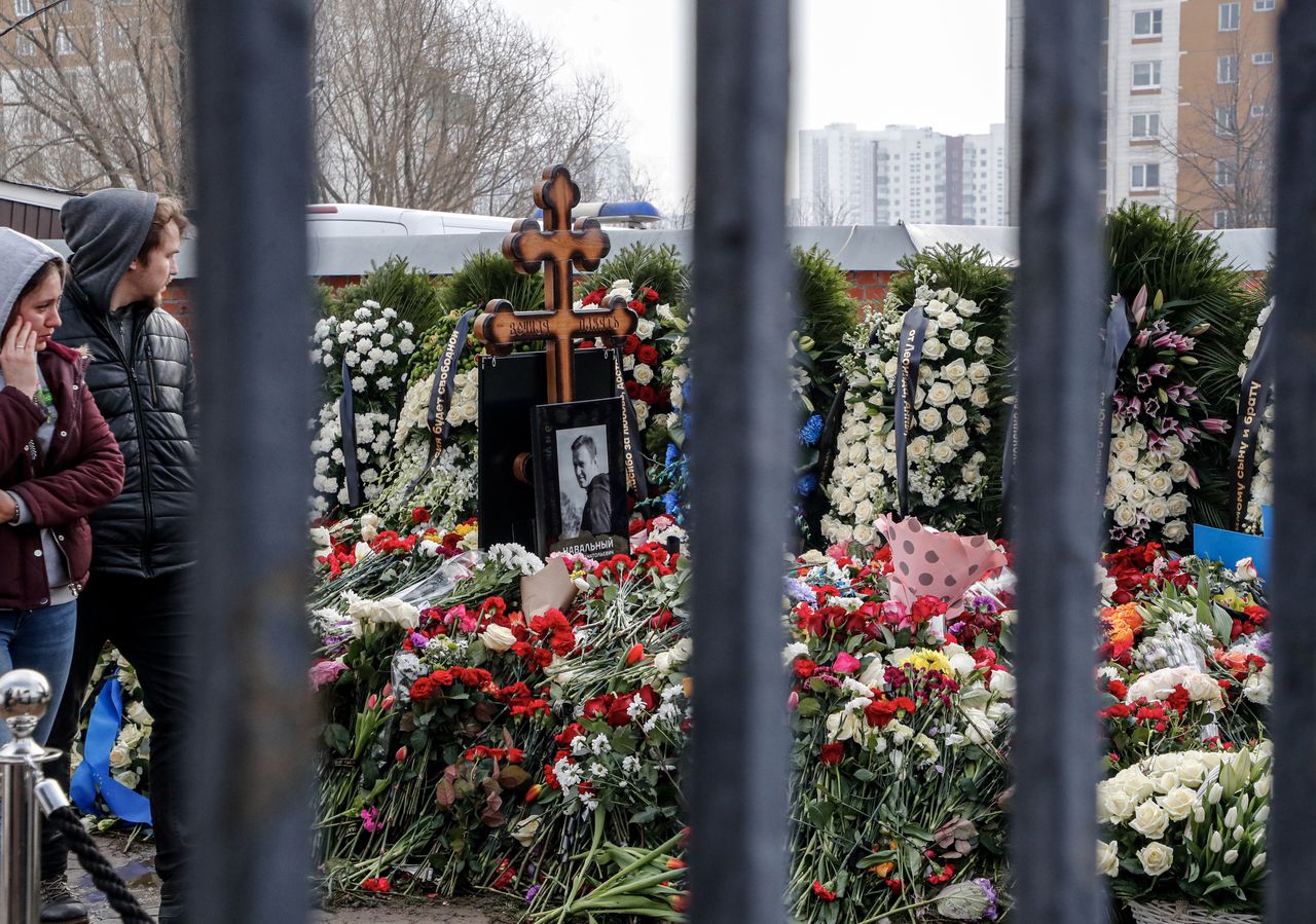 Crowds of Russians still gather at the grave of Alexei Navalny.