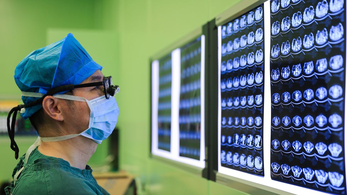 NANJING, CHINA - AUGUST 18, 2024 - A doctor looks at the results of a medical image examination of a patient at the Jiangsu Provincial People's Hospital in Nanjing, Jiangsu province, China, August 19, 2024. (Photo credit should read CFOTO/Future Publishing via Getty Images)