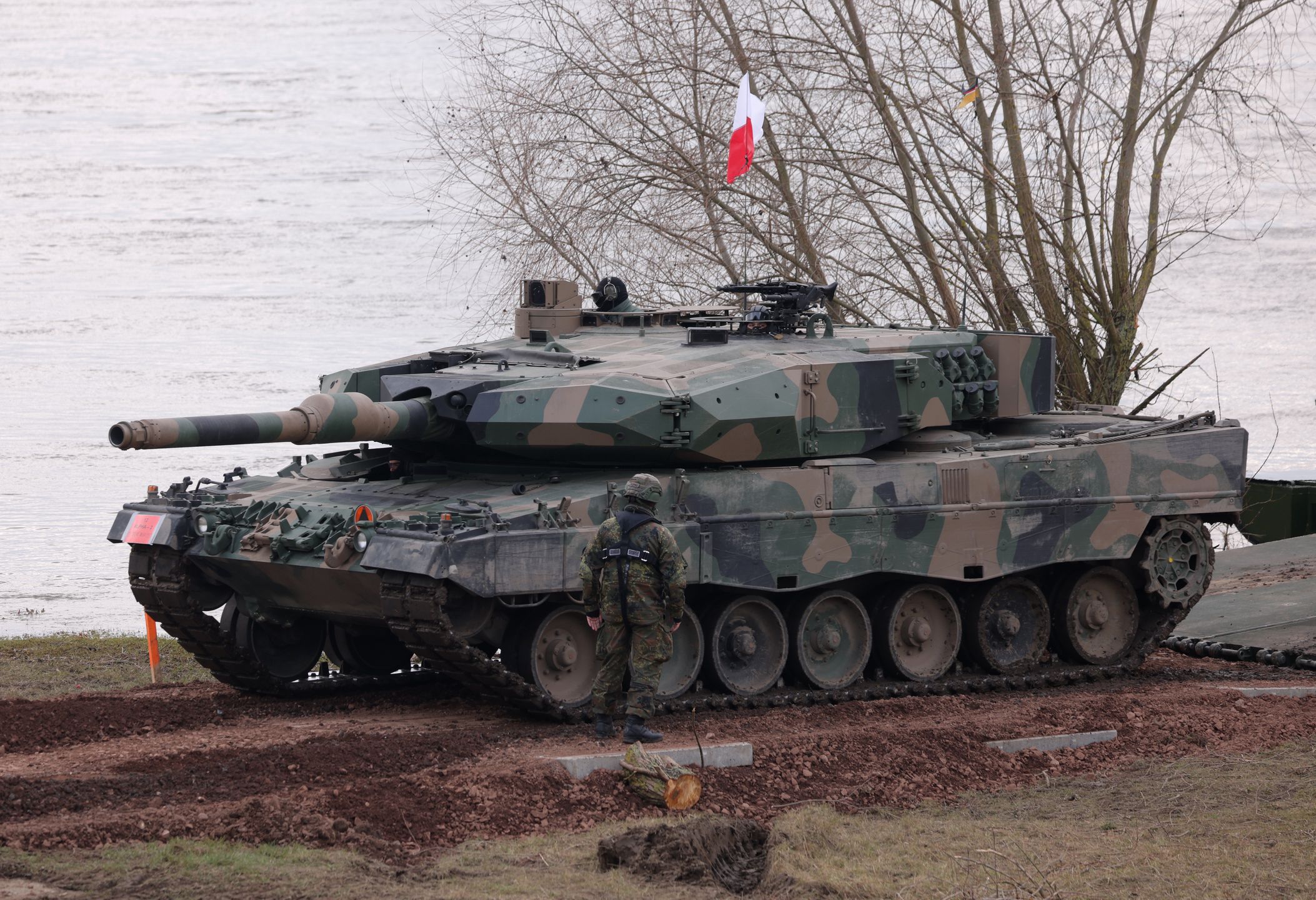 GNIEW, POLAND - MARCH 04: A Leopard 2PL main battle tank of the Polish armed forces finishes crossing the Vistula River during the NATO Dragon 24 military exercise on March 04, 2024 near Gniew, Poland. Dragon 24 is involving 20,000 troops from 10 different nations and is part of Steadfast Defender 2024, an ongoing set of NATO military manoeuvres across Europe that is involving 90,000 troops. (Photo by Sean Gallup/Getty Images)