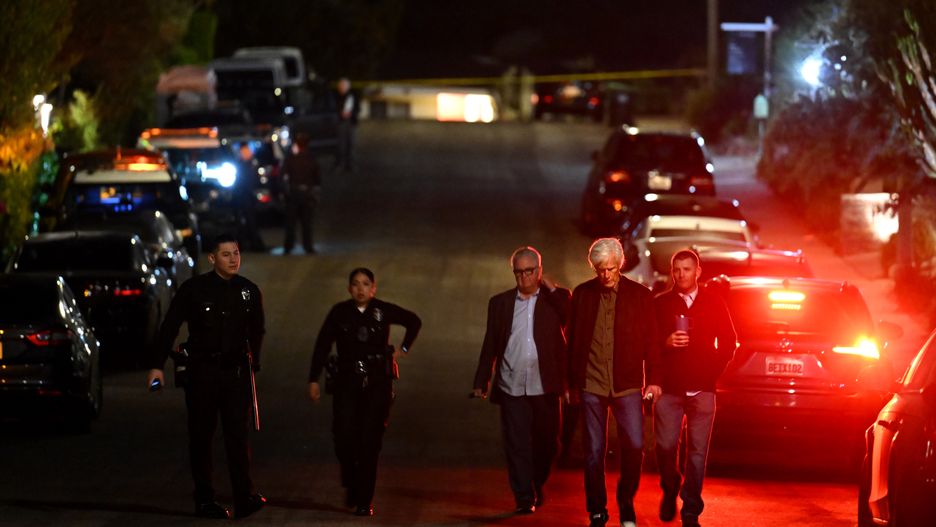 Los Angeles, California October 28, 2023-Keith Morrison, second from right, walks with police investigators down the street from where Matthew Perry's house in Pacific Palisades Saturday night. (Wally Skalij/Los Angeles Times via Getty Images)