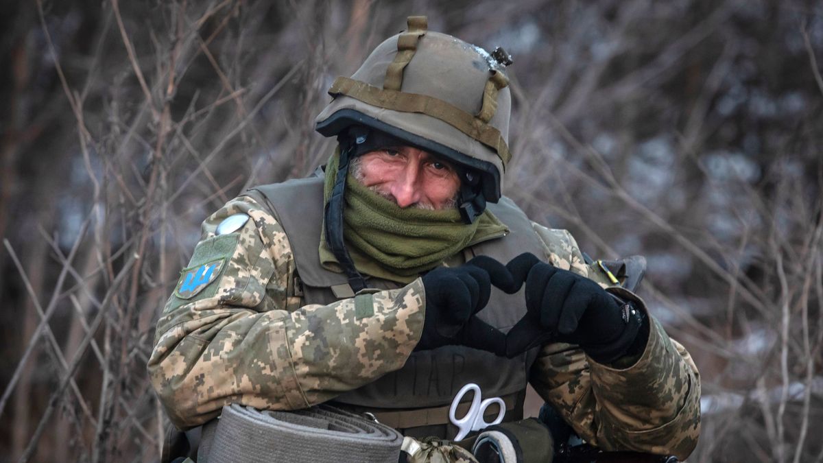 DONETSK OBLAST, UKRAINE - FEBRUARY 11: Ukrainian military man gestures a heart shape with his hands in the Bakhmut area on February 11, 2023 in Donetsk Oblast, Ukraine. Russia has launched a new winter offensive in the Donbas. (Photo by Yevhenii Zavhorodnii/Global Images Ukraine via Getty Images)