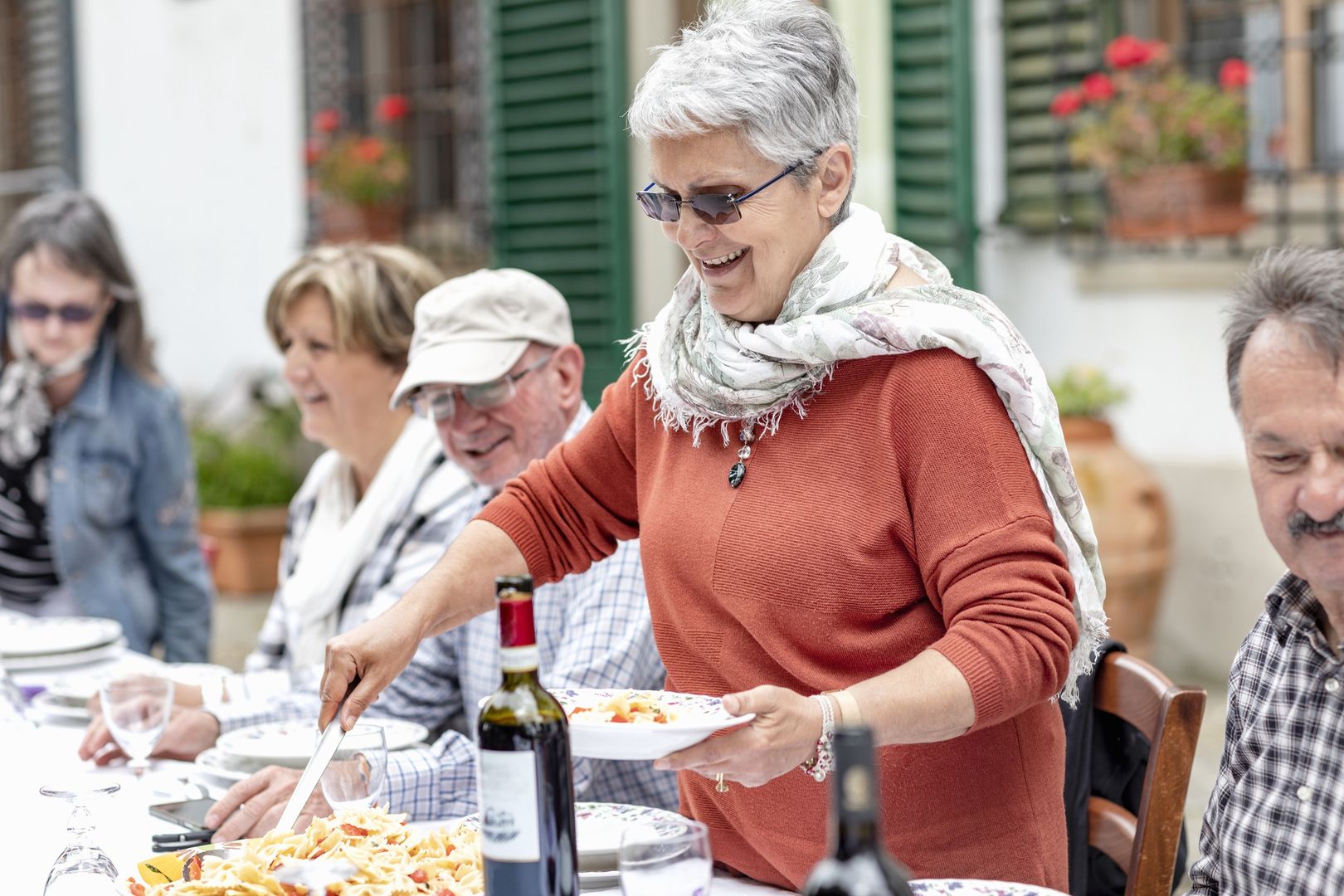 Woman serving pasta at family lunch in garden, Florence, Italy
Innocenti
both male and female, consuming food, couple, florence, garden, leisure, male, traditional culture, wood