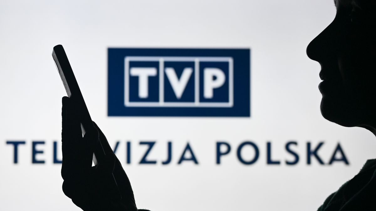EDMONTON, CANADA - APRIL 28:
An image of a woman holding a cell phone in front of the TVP - Telewizja Polska media company logo displayed on a computer screen, on April 29, 2024, in Edmonton, Canada. (Photo by Artur Widak/NurPhoto via Getty Images)