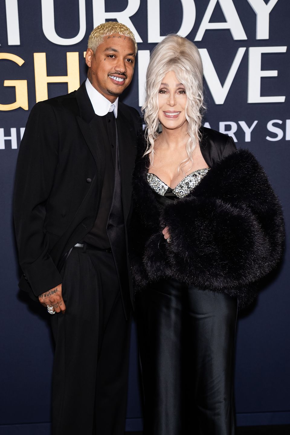 NEW YORK, NEW YORK - FEBRUARY 16: Alexander Edwards (L) and Cher attend the SNL50: The Anniversary Special at 30 Rockefeller Center on February 16, 2025 in New York City. (Photo by TheStewartofNY/WireImage)