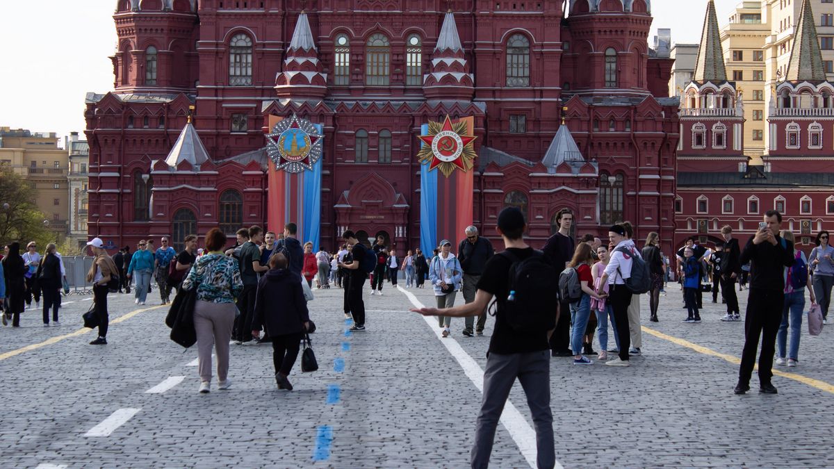 MOSCOW, RUSSIA - 2023/04/24: A tourist poses for a photo at Red Square with Victory Day decorations seen outside the State Museum in the Red Square. Russia celebrates Victory Day every year on May 9. Mass media reports that in 2023, only one foreign head of state will attend the traditional military parade on Red Square. (Photo by Vlad Karkov/SOPA Images/LightRocket via Getty Images)
