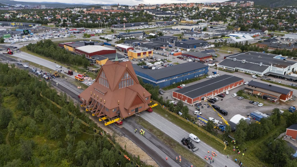 KIRUNA, SWEDEN - AUGUST 20: In this aerial view, the Kiruna Kyrka church is transported by road to a new location on August 20, 2025 in Kiruna, Sweden. The church, weighing 672,4 tons, is being transported as a whole to a new location 3 km away to avoid damages caused by LKAB´s iron ore mine. (Photo by Bernd Lauter/Getty Images)