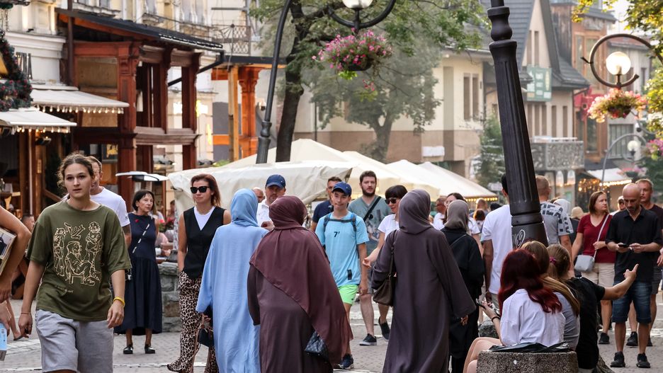 Families walk on a landmark Krupowki Street in the center of Zakopane, a popular Tatra mountain holiday resort on the last weekend of school holiday in Southern Poland on August 30, 2024. (Photo by Dominika Zarzycka/NurPhoto via Getty Images)