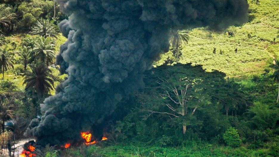 Violence And Poverty Plagues Oil Rich The Niger DeltaNEAR PORT HARCOURT, NIGER DELTA, NIGERIA - OCTOBER 12: Crude oil from a spill burns October 12, 2004 in Goi, Nigeria. Shell claims the spill is from a sabotaged pipeline. The Niger Delta, where the bulk of Nigeria's oil comes from, is plagued by violence between rival warlords, ethnic groups, and the government frequently leading to the kidnapping of oil workers and interfering with oil production. A member of OPEC, Nigeria is the world's seventh largest crude oil exporter, and the fifth largest supplier to the U.S. Royal Dutch/Shell leads Exxon Mobil, Chevron Texaco, Total Fin Elf and Agip in production through a series of joint ventures with the government. Despite producing 2.26 million barrels of oil a day, 60 percent of Nigerians live below the poverty line. (Photo by Jacob Silberberg/Getty Images)Jacob Silberbergoil political politics black gold delta crude poor poverty coast