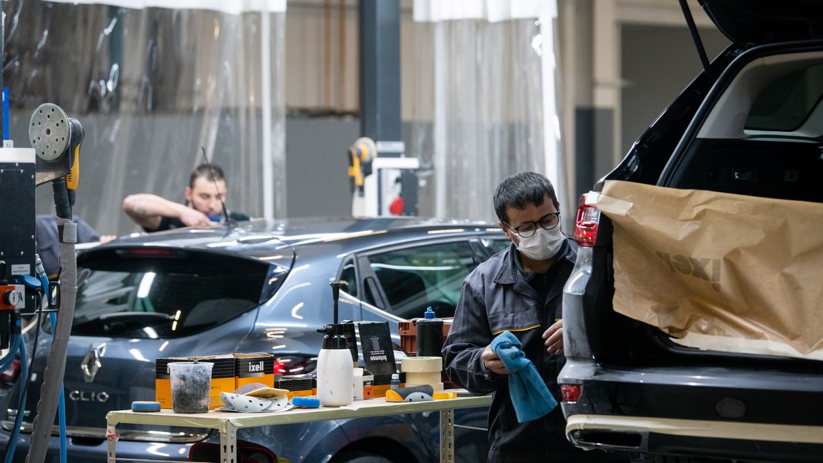 Technicians work on used vehicles at Renault SA's Re-Factory plant in Flins, France, on Tuesday, Nov. 30, 2021. The factory west of Paris, which makes the Zoe electric vehicle and the Nissan Micra, will transform by 2024 to recycle and retrofit cars and batteries. Photographer: Benjamin Girette/Bloomberg via Getty Images
