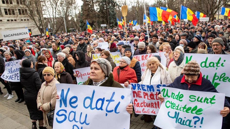 arch54A woman (front) holds a sign theat reads, 'Give us or leave', during a protest against the Moldovan Government and their pro-EU President in Chisinau on February 19, 2023. - A couple of thousands of protesters gathered in downtown Chisinau answering the call made by "SOR" Party, as tension run high in pro-Western Moldova after allegations of Moscow's attempts to destabilise the country came to light last week. Facing multiple crises aggravated by Russia's war in Ukraine, the impoverished former Soviet republic of 2.6 million people wedged between Romania and Ukraine, Moldova is already wrestling with an energy crisis prompted by supply cuts from Russia's targeting of Ukraine's energy infrastructure, and tensions have flared up due to missile overflights connected to the war in Ukraine. (Photo by Elena COVALENCO / AFP)ELENA COVALENCO