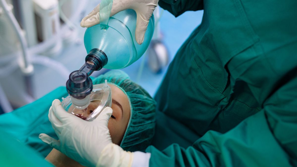 Patient being sedated by anesthesiologist before surgical procedurePatient being sedated by anesthesiologist before surgical procedureEmirMemedovski