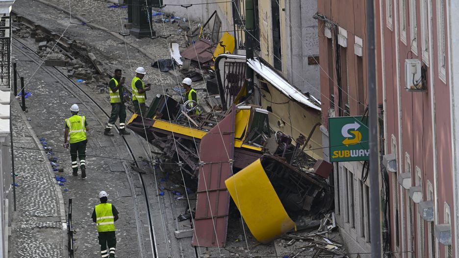 LISBON, PORTUGAL - SEPTEMBER 04: Carris personnel inspect the wrecked Gloria funicular on September 04, 2025 in Lisbon, Portugal. Seventeen people were killed and around 20 injured when a car on the Glória Funicular derailed in Lisbon. The iconic funicular railway line, also called Elevador da Glória, connects Lisbon's Restauradores Square to the neighborhood of Bairro Alto via a steep 275 meter (900ft) climb, and is popular among tourists. (Photo by Horacio Villalobos/Getty Images)