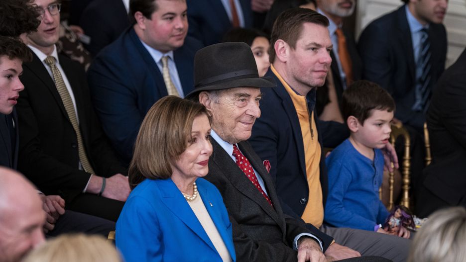 Representative Nancy Pelosi, a Democrat from California, and her husband Paul Pelosi, center, during an event hosting the Golden State Warriors in the East Room of the White House in Washington, DC, US, on Tuesday, Jan. 17, 2023. President Biden is honoring the team to celebrate their 2022 NBA championship against the Boston Celtics. Photographer: Al Drago/Bloomberg via Getty Images