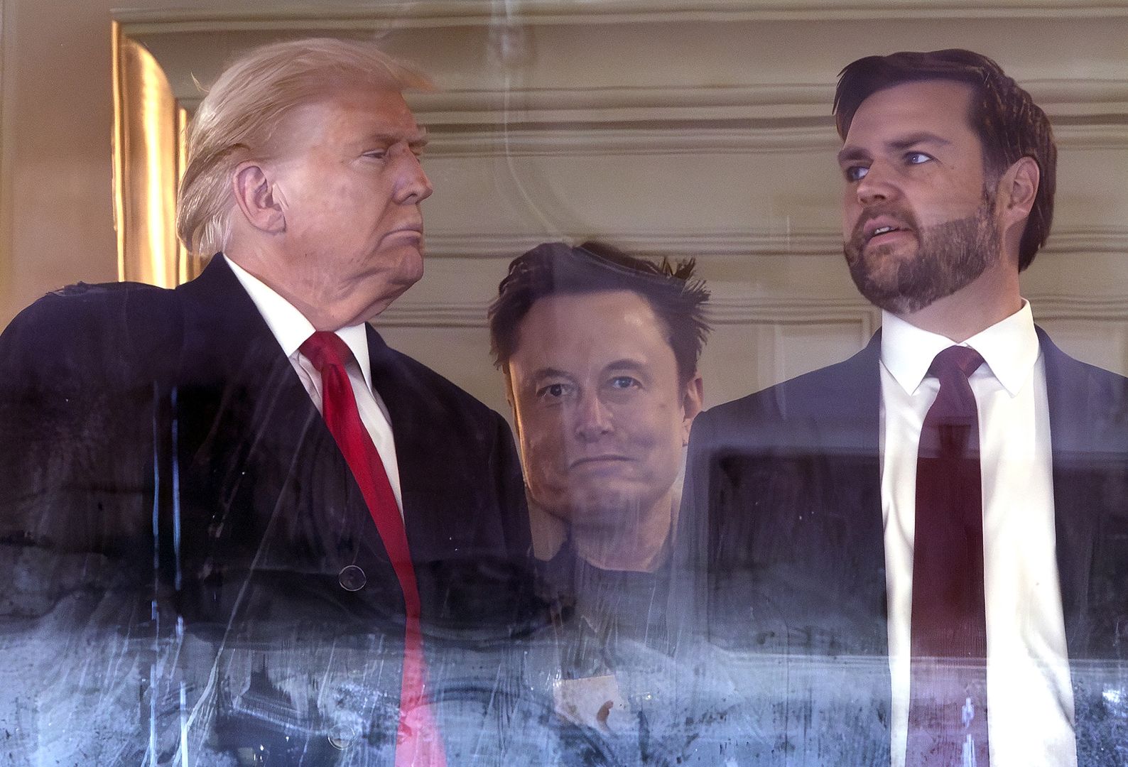 LANDOVER, MARYLAND - DECEMBER 14: (L-R) U.S. President-elect Donald Trump, Tesla CEO Elon Musk and Vice President-elect JD Vance attend the 125th Army-Navy football game at Northwest Stadium on December 14, 2024 in Landover, Maryland. Trump is attending the game with lawmakers and Cabinet nominees including, Vice President-elect JD Vance, Speaker of the House Mike Johnson (R-LA), Defense Secretary nominee Pete Hegseth, incoming Senate Majority Leader John Thune (R-SD) and others. (Photo by Kevin Dietsch/Getty Images)