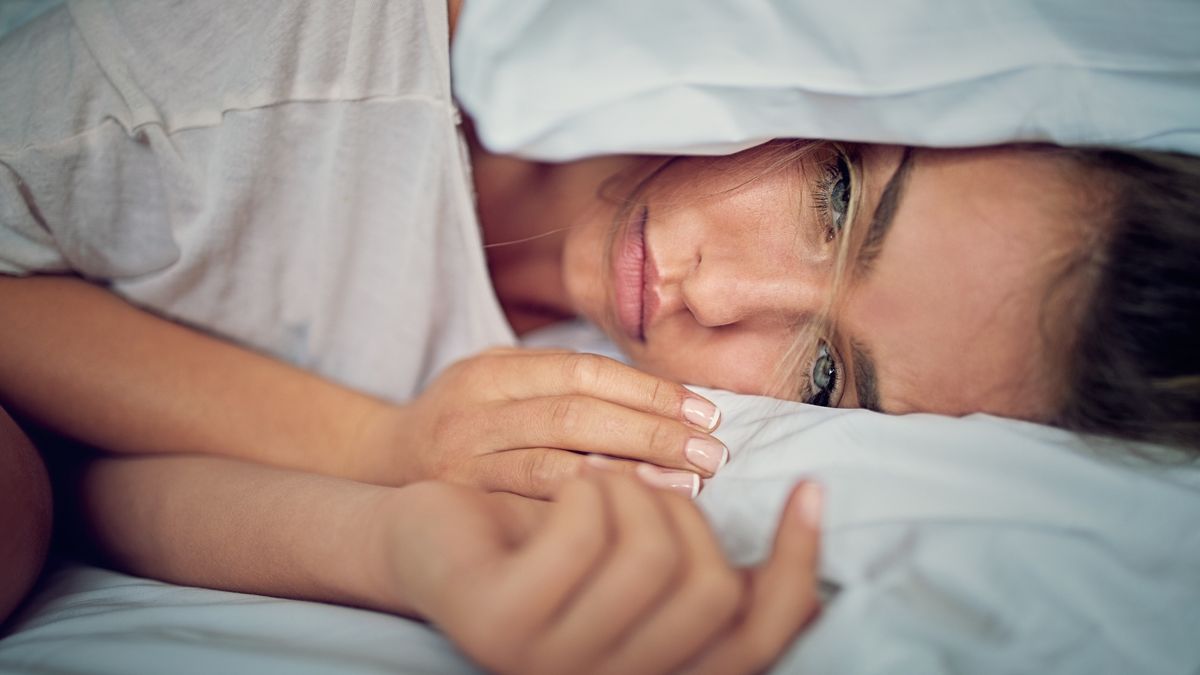Young girl with relationship difficulties is crying and holding her head under the pillow
Young girl with relationship difficulties is crying and holding her head under the pillow
praetorianphoto