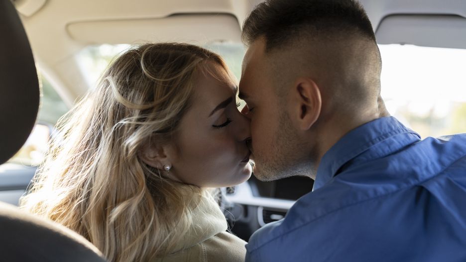 Romantic couple kissing each other in car
Westend61