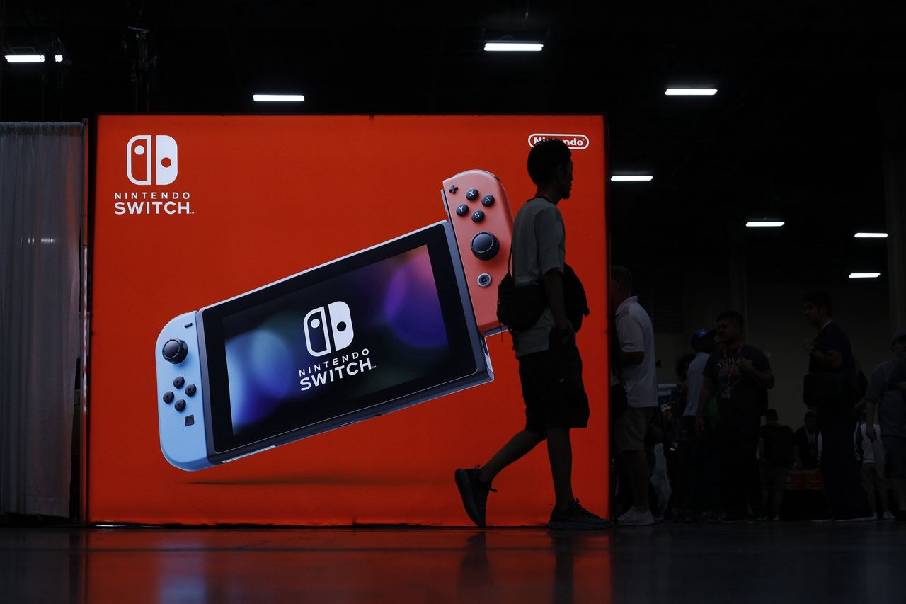 LAS VEGAS, NEVADA - AUGUST 02: Attendees walk by the Nintendo booth during day one of the 2019 Evolution Championship Series at Mandalay Bay Resort and Casino on August 02, 2019 in Las Vegas, Nevada. (Photo by Joe Buglewicz/Getty Images)