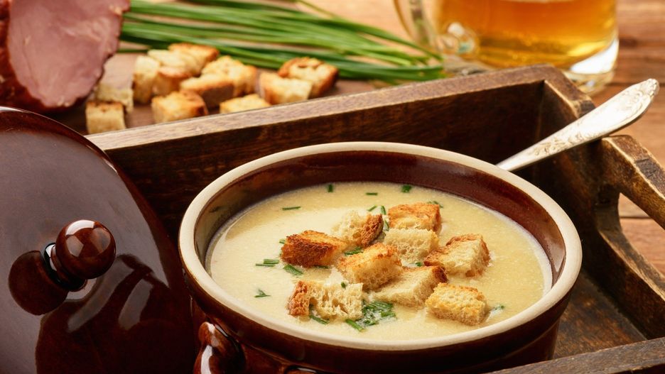 Beer cream soup with chicken fillet, ham and cheese.