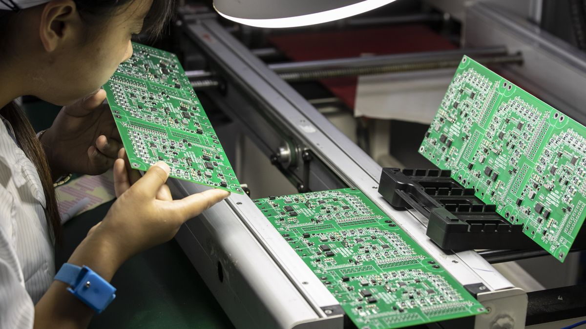 An employee inspects integrated circuit boards at the Smart Pioneer Electronics Co. factory in Suzhou, China, on Friday, Sept. 23, 2022. In a world where chips are becoming smarter and smaller, they require much less advanced technology to manufacture and therefore command smaller margins. Photographer: Qilai Shen/Bloomberg via Getty Images