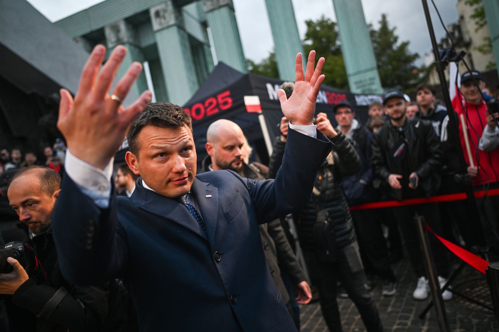 WARSAW, POLAND - MAY 10: Presidential Candidate for the far right wing Confederation Party, Slawomir Mentzen gesticulates as he walks to meet with supporters after delivering a speech during a presidential campaign rally on May 10, 2025 in Warsaw, Poland. The presidential election in Poland will be held on May 18. (Photo by Omar Marques/Getty Images)