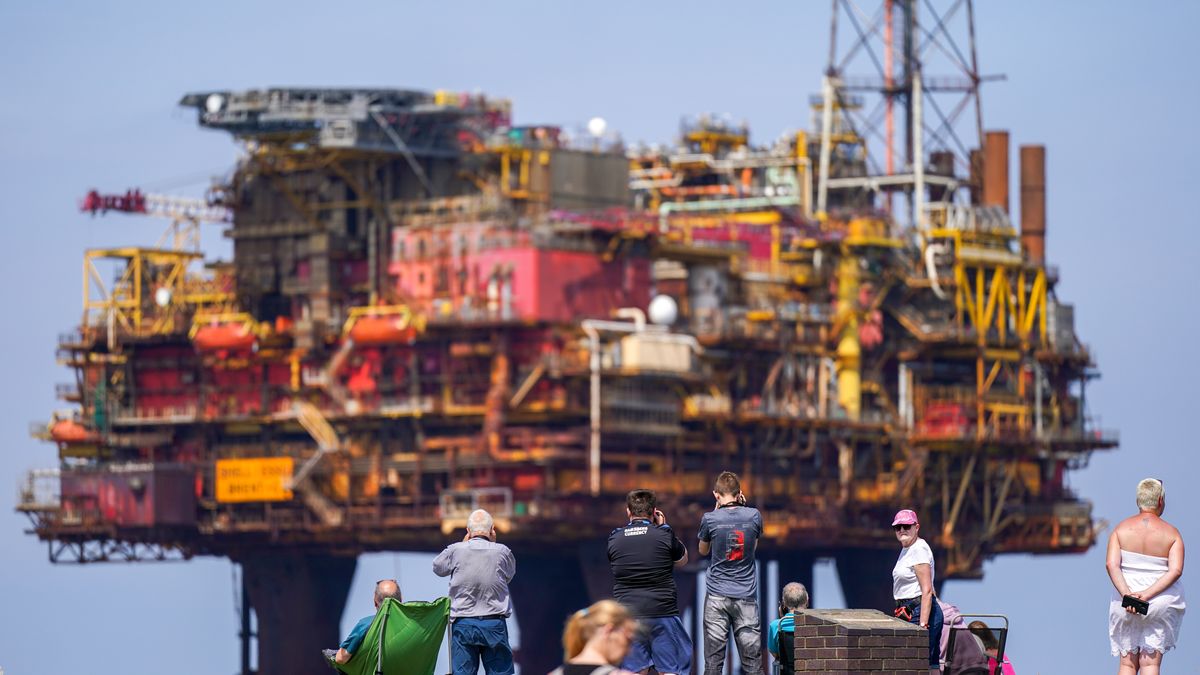 MIDDLESBROUGH, ENGLAND - JULY 19: The Brent Charlie topside oil rig is towed on the Allseas Iron Lady cargo barge into the mouth of the River Tees as it heads for dismantling at the Able Seaton Port yard on July 19, 2024 in Middlesbrough, England. The 32,000-tonne Brent Charlie is the last rig from the Brent Field in the North Sea off the UK's east coast. At one point, the Brent Field produced 184 million barrels of oil a year, earning billions for Shell and tax revenues for the Exchequer. Of the four oil platforms needed to extract oil, Brents Alpha, Bravo, and Delta have already been scrapped. The Brent Field is one of many North Sea fields closing down and plugging wells. The removal of the Brent Charlie topside at the Brent oil field by the crane ship, Pioneering Spirit, was the heaviest offshore platform single-lift removal in history. (Photo by Ian Forsyth/Getty Images)