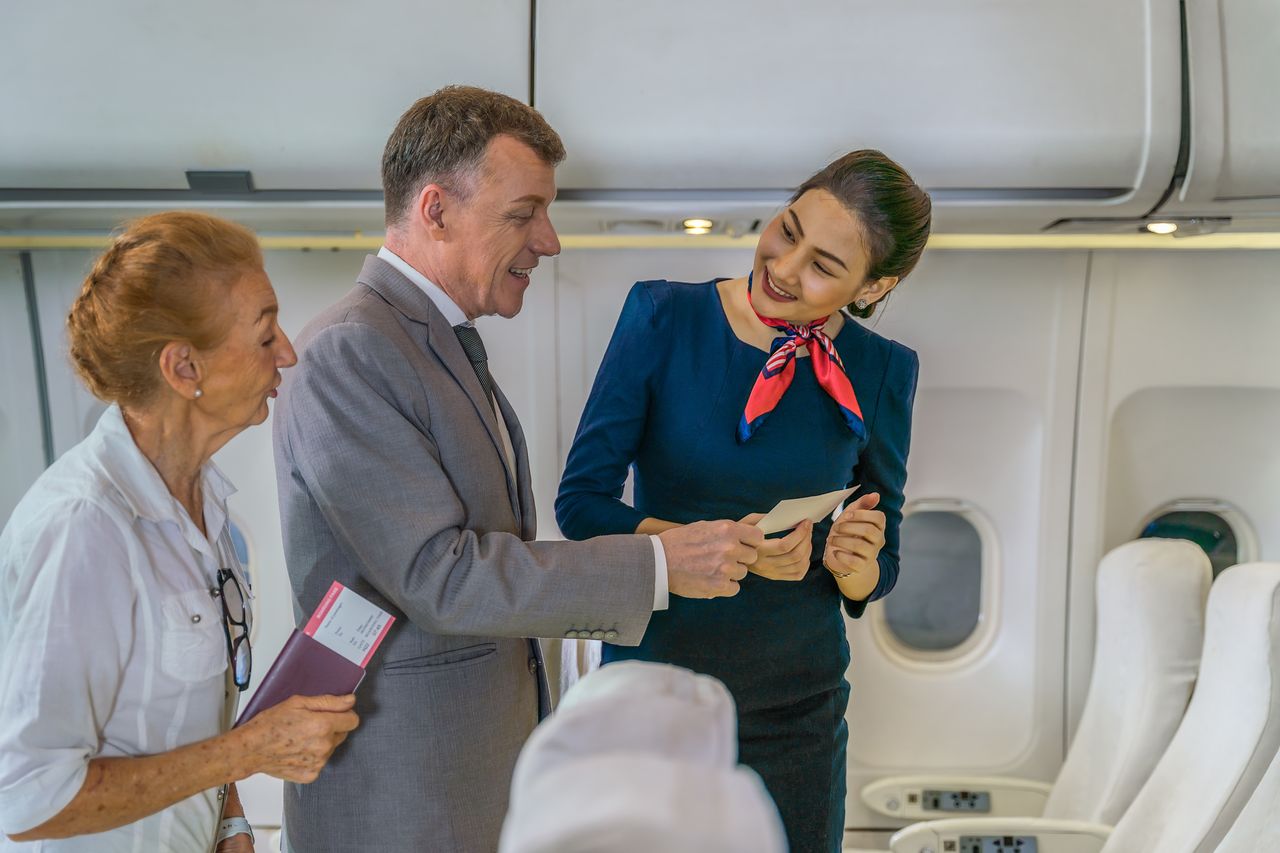 The cabin crew carefully observe the passengers during the greeting.