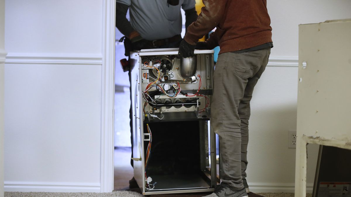 Propane And Natural Gas Prices Surge Ahead Of Heating Season
Workers carry a new Carrier natural gas furnace to install at a residential home in Spanish Fork, Utah, U.S.,  on Tuesday, Oct. 19, 2021. Staying warm this winter in the country will come at a higher cost this year along with most other consumer expenses as heating oil, natural gas and other fuels surge in price, reports Newsweek. Photographer: George Frey/Bloomberg via Getty Images
Bloomberg
us, fuels, u.s.a., fossil fuels, americas, north american, energy, natural resources, american, oil, gas, business news, united states of america, industries