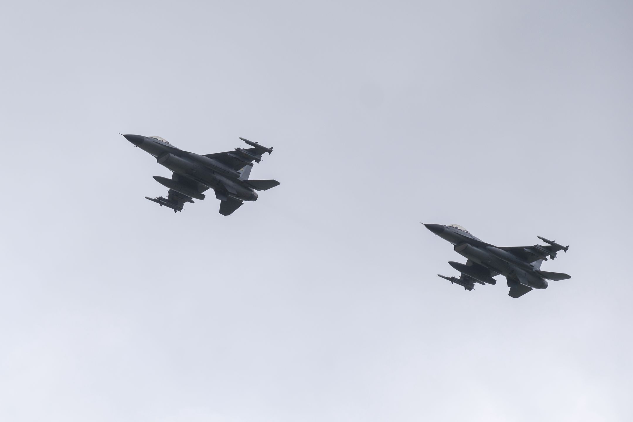 UNSPECIFIED, UKRAINE - AUGUST 4: The first General Dynamics F-16 Fighting Falcons received by Ukraine fly on the Day of Ukrainian Air Force on August 4, 2024 in Unspecified, Ukraine. At the event for the Day of Ukrainian Air Force with the participation of President of Ukraine Volodymyr Zelenskyi, the first General Dynamics F-16 Fighting Falcons received by Ukraine were demonstrated. (Photo by Vitalii Nosach/Global Images Ukraine via Getty Images)