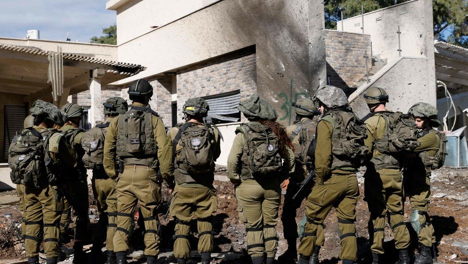 Temporary
Israeli army forces stand outside a house that was hit by rockets fired by Hezbollah from Lebanon in the northern Israeli border town of Kiryat Shmona on November 26, 2024, amid the continuing war between Israel and the Lebanese militant group. Israel's security cabinet will meet later on November 26 to discuss a proposed ceasefire deal in its war with Hezbollah in Lebanon, Israeli deputy foreign minister Sharren Haskel said. (Photo by Jalaa MAREY / AFP)
JALAA MAREY