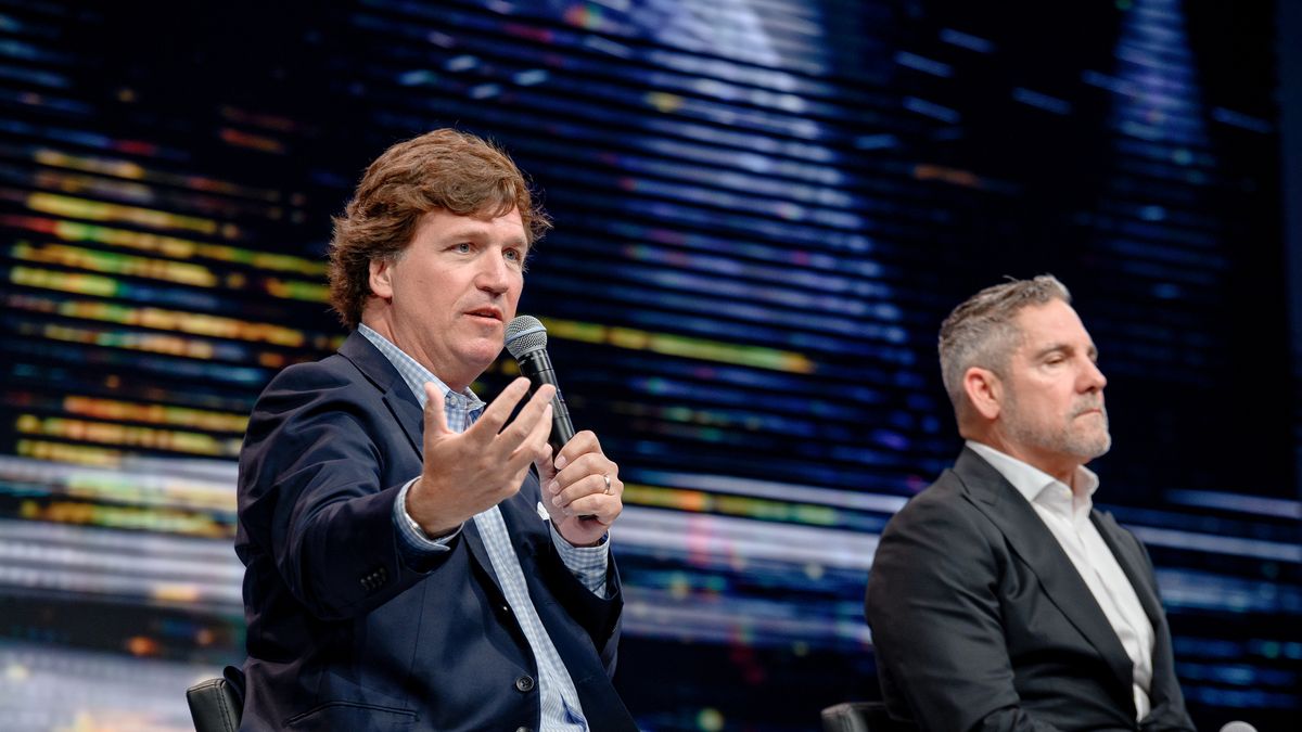 HOLLYWOOD, FLORIDA - APRIL 02: Tucker Carlson and Grant Cardone speak during the 10X Growth Conference 2024 at The Diplomat Beach Resort on April 02, 2024 in Hollywood, Florida. (Photo by Ivan Apfel/Getty Images)