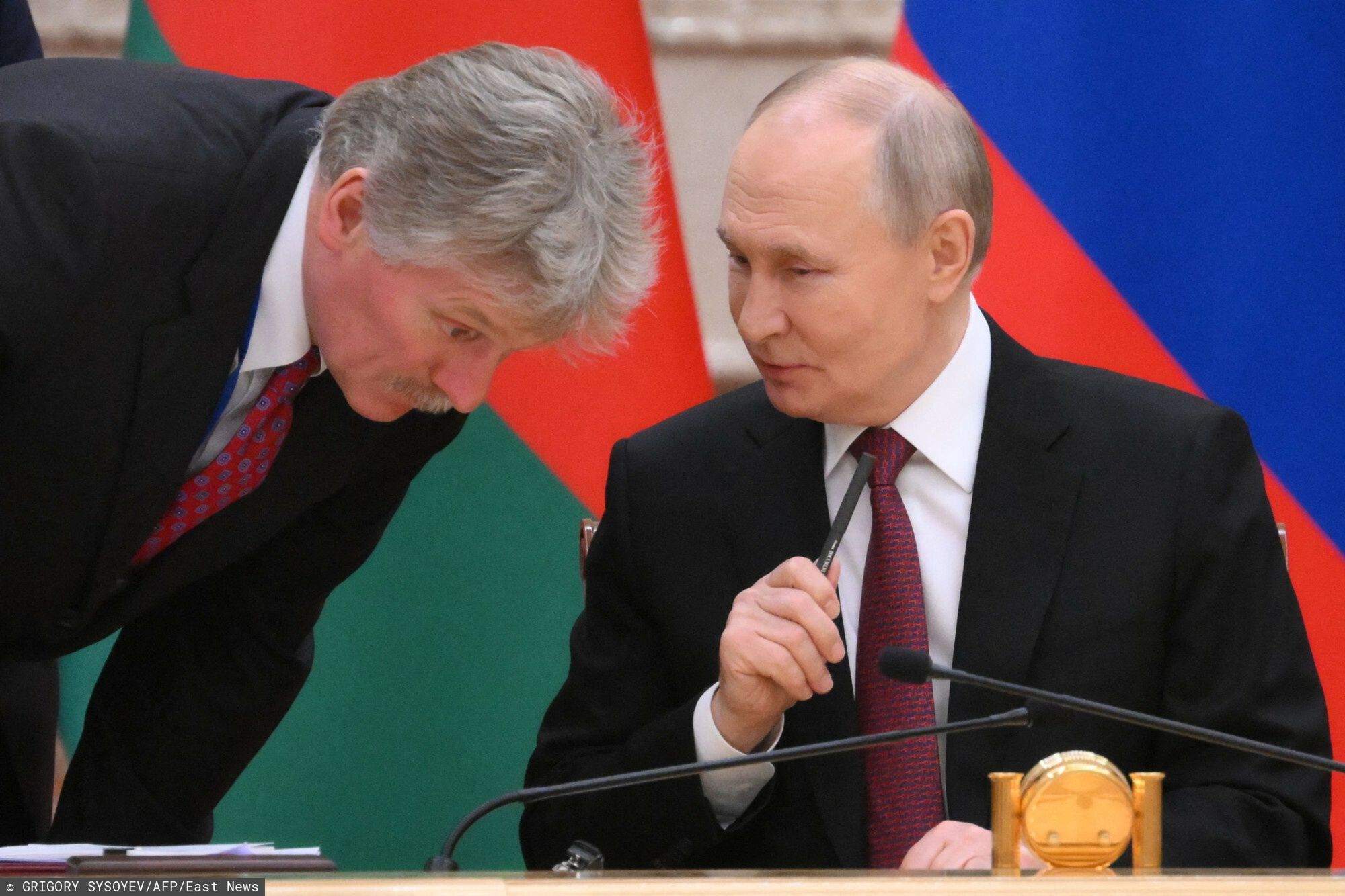 Temporary
In this pool photograph distributed by the Russian state agency Sputnik, Russia's President Vladimir Putin talks to Kremlin spokesman Dmitry Peskov during a signing ceremony with Belarus' President during a meeting of the Supreme State Council of the Union State of Russia and Belarus, at the presidential palace in Minsk on December 6, 2024.  (Photo by Grigory SYSOYEV / POOL / AFP)
GRIGORY SYSOYEV