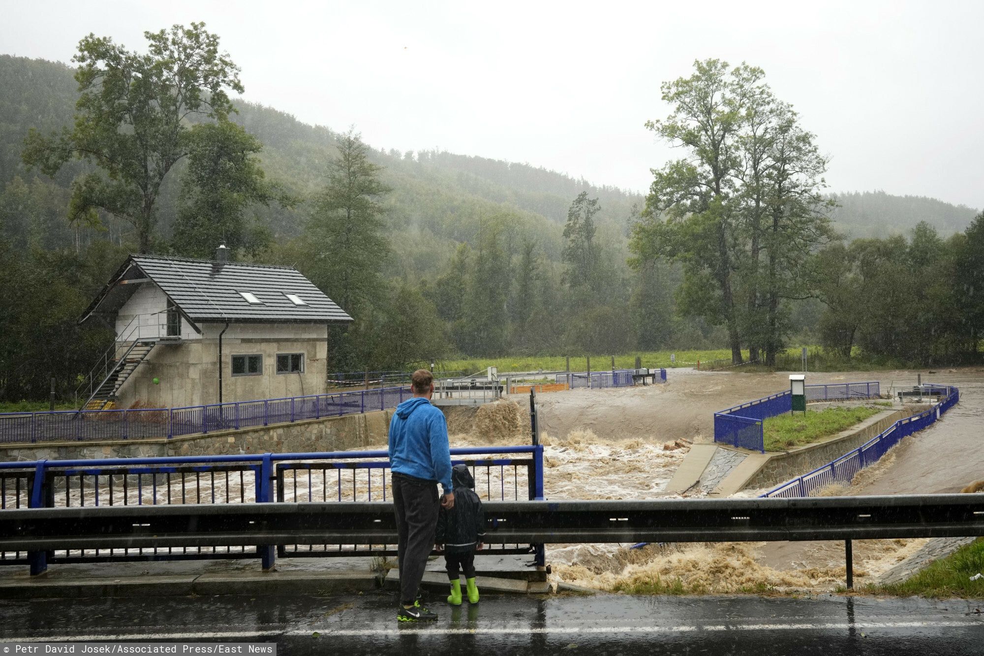 Temporary
Residents watch the rising levels of the Opava river near Brantice, Czech Republic, Saturday, Sept. 14, 2024. (AP Photo/Petr David Josek)
Petr David Josek
