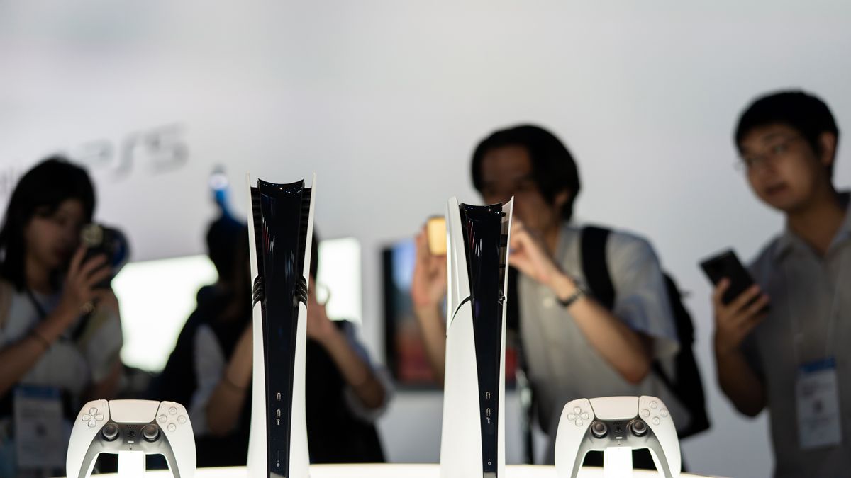 CHIBA, JAPAN - SEPTEMBER 26: Attendees take photographs of Sony PlayStation 5 Pro (L) and PlayStation 5 Digital Edition (R) video game consoles displayed during the Tokyo Game Show 2024 at Makuhari Messe on September 26, 2024 in Chiba, Japan. September 29. The one of the world's largest gaming exhibitions will be held through September 29. (Photo by Tomohiro Ohsumi/Getty Images)