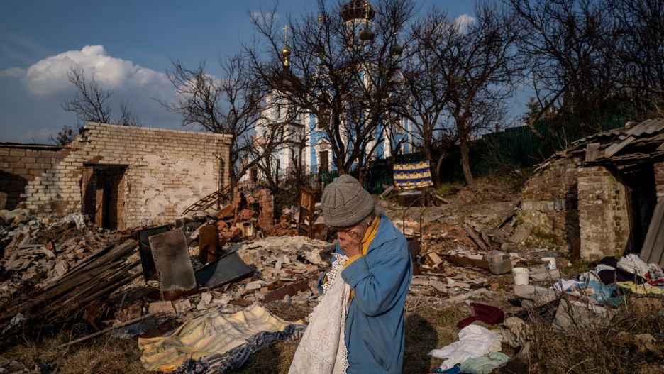 BOHORODYCHNE, UKRAINE - MARCH 24: 67 year-old Lyubov Yergorivna cries in front of the her destroyed home as daily life continues under difficult conditions amid Russia-Ukraine war in the village of Bohorodychne of Donetsk Oblast, Ukraine on March 24, 2023. The village of Bohorodychne in the Donetsk Oblast of eastern Ukraine was one of the frontlines of the war in June and was under control of Russian forces in August until it was liberated by Ukrainian forces in September 2022. (Photo by Wolfgang Schwan/Anadolu Agency via Getty Images)