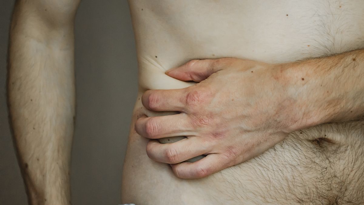 The man is holding his side. Close up.
The man is holding his side. The pain in his side. Appendicitis. The concept of medicine and health. Acute pain. Close up.
Anastasiia Gorshkova
gastritis